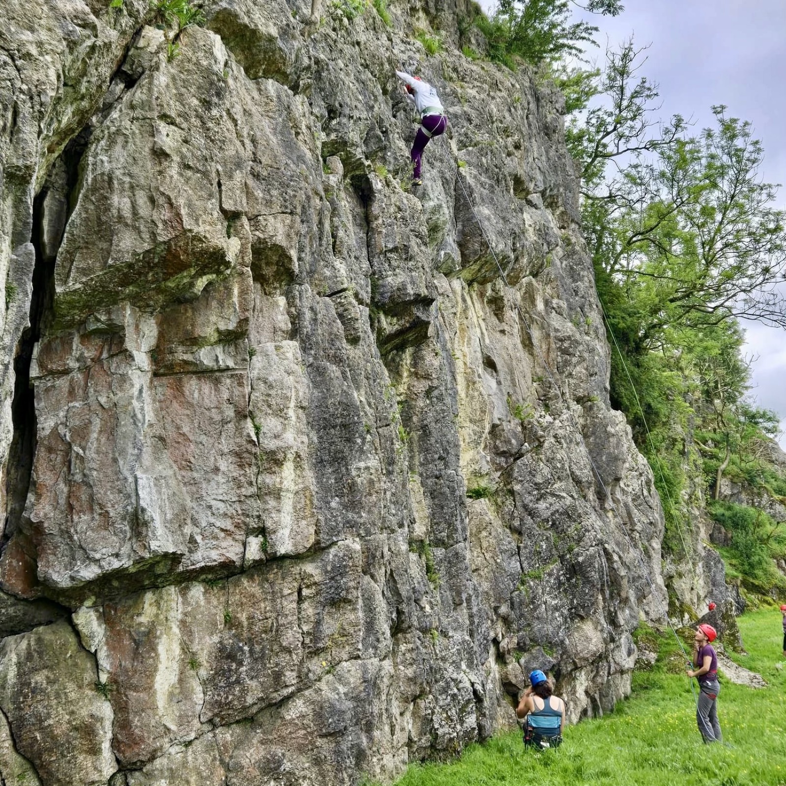 Gent descends on hoist into cabin while giving cool sign