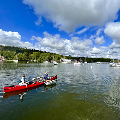Caver crawls through a tight space 