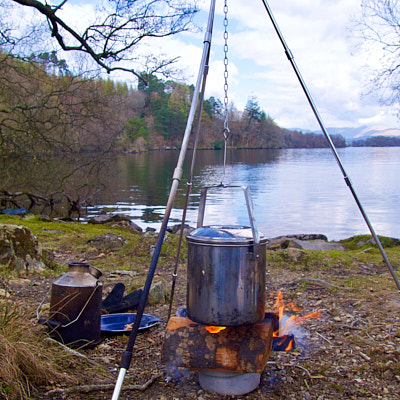 Yacht sails with sun shining through near Aaron