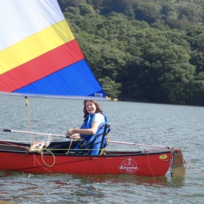 Canoe sailer smiles back