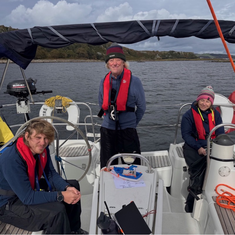 Sun shines through a yachts sails