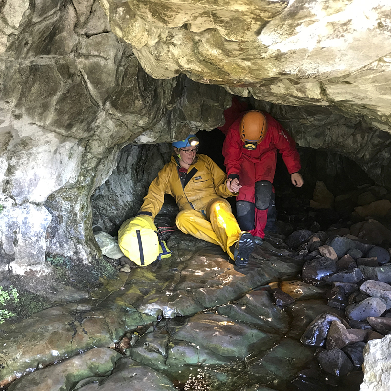 caver being guided in cave
