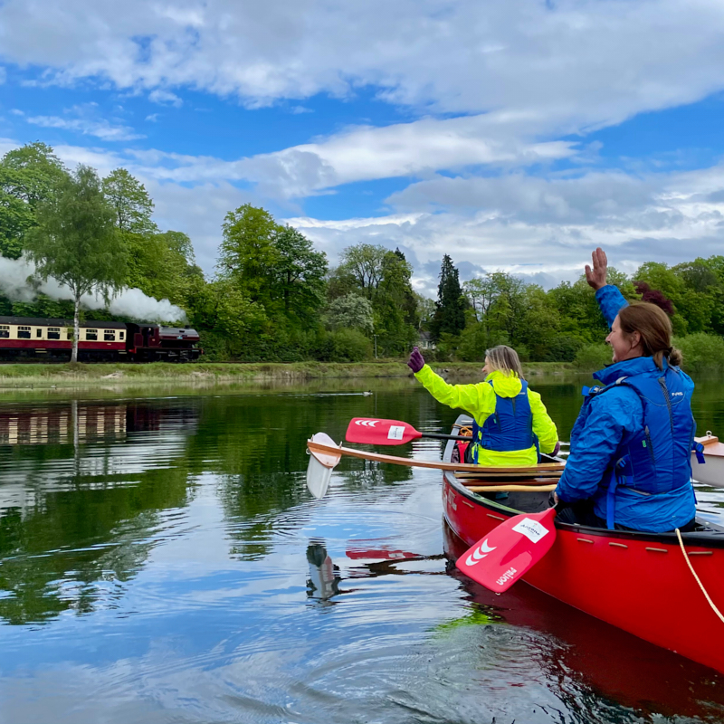 Waving at the steam train