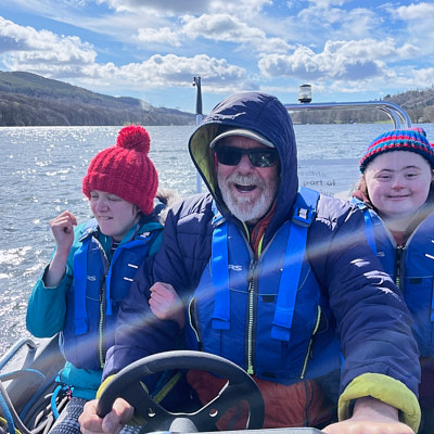 Caver crawls through a tight space 