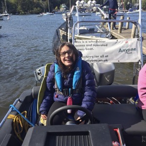Wheelchair users drives powerboat