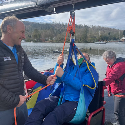 Person using a gantry hoist to access canoe