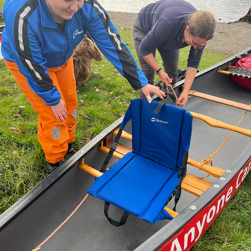 Wheel chair users sailing canoe