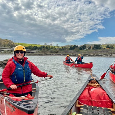 Smiling canoist eddies out tidal