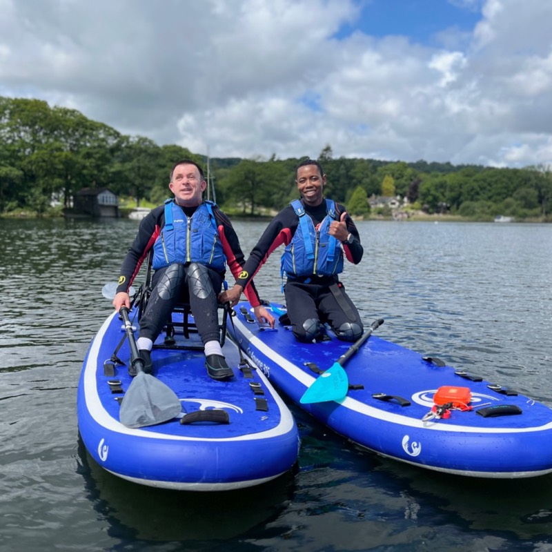 Caver crawls through a tight space 