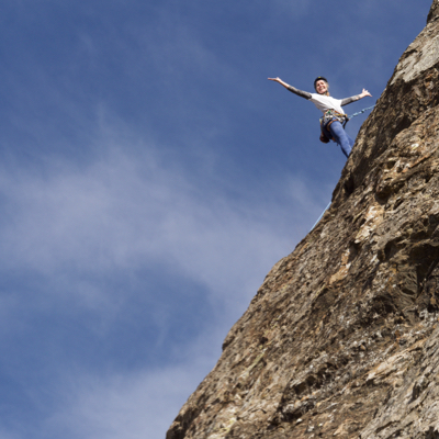 lady and dog paddle tranquil loch.